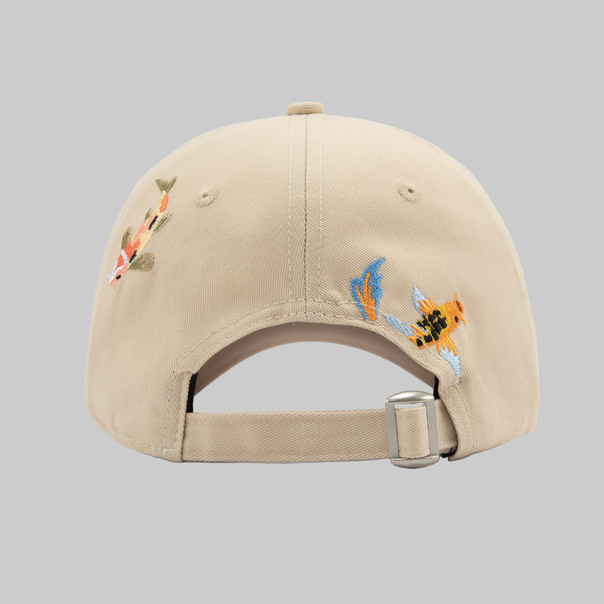 Beige cap with embroidered designs on a white background