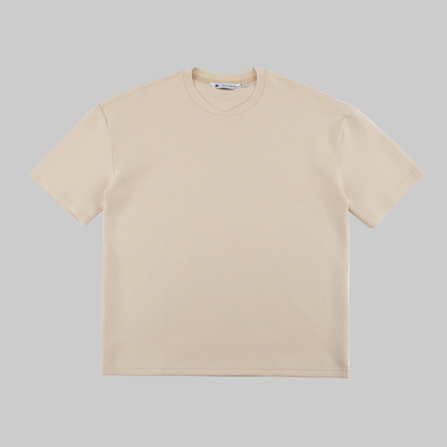 Beige t-shirt on a white background