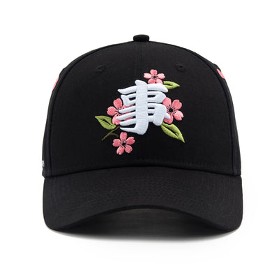 Black cap with floral and white logo design on a white background