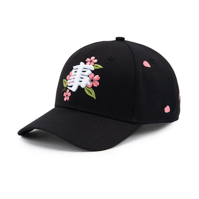Black cap with floral embroidery on a white background