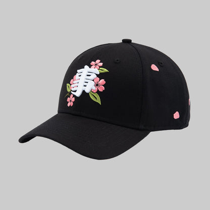 Black cap with floral embroidery on a white background