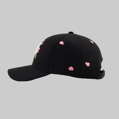 Black cap with pink sakura pettals patterns on a white background