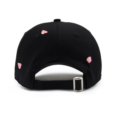 Black cap with pink sakura petals shapes on a white background
